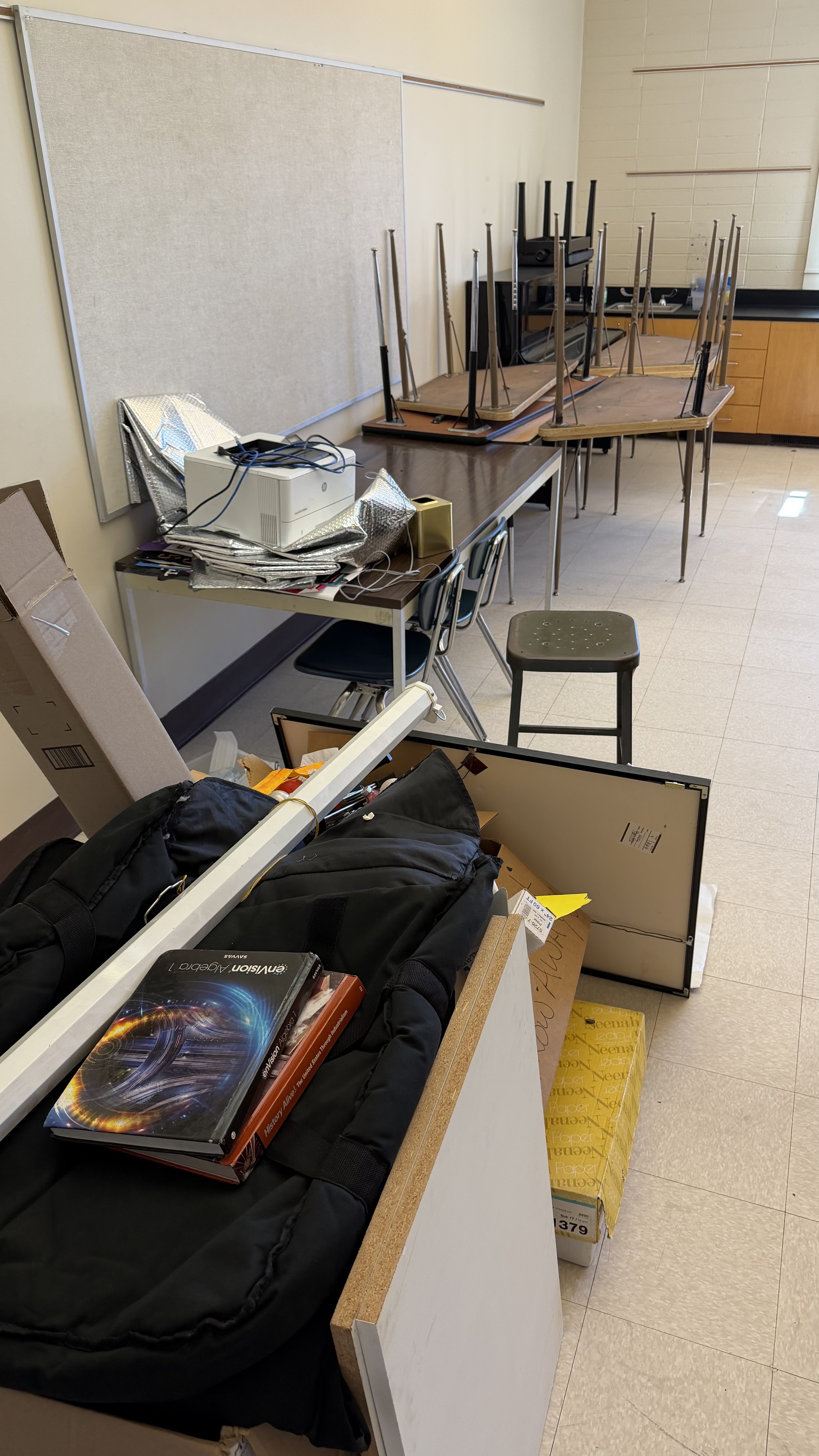 Before — classroom full of old furniture and equipment